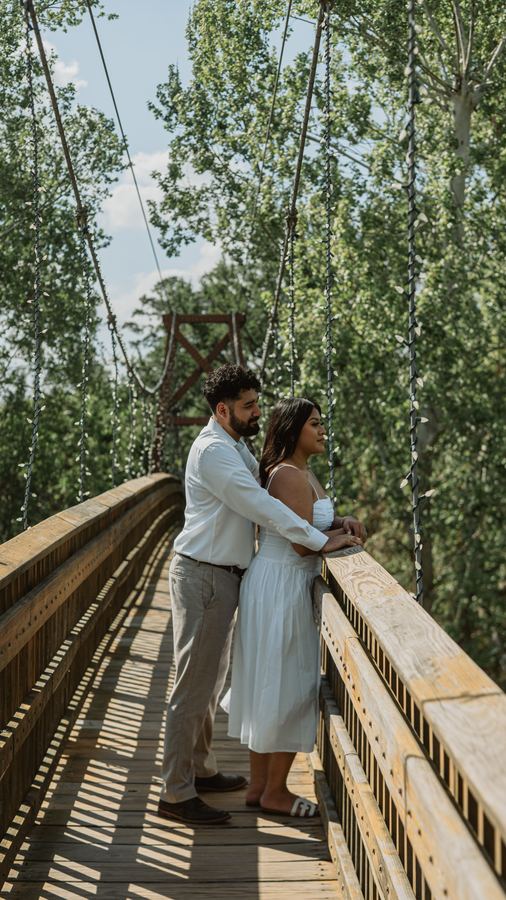Jasmin and Edgar on a wooden bridge among tall trees