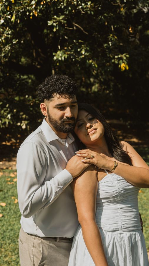 Edgar holding Jasmin close as she leans into him