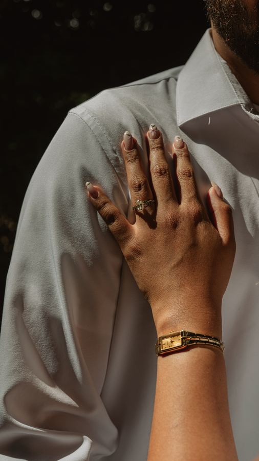 Jasmin's hand resting on Edgar's chest